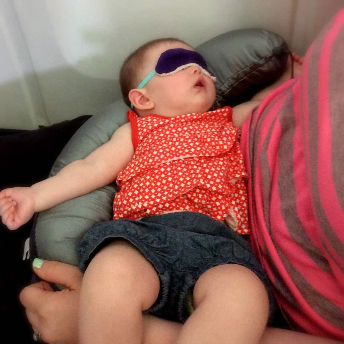 Sleeping on the airplane with the sleep mask