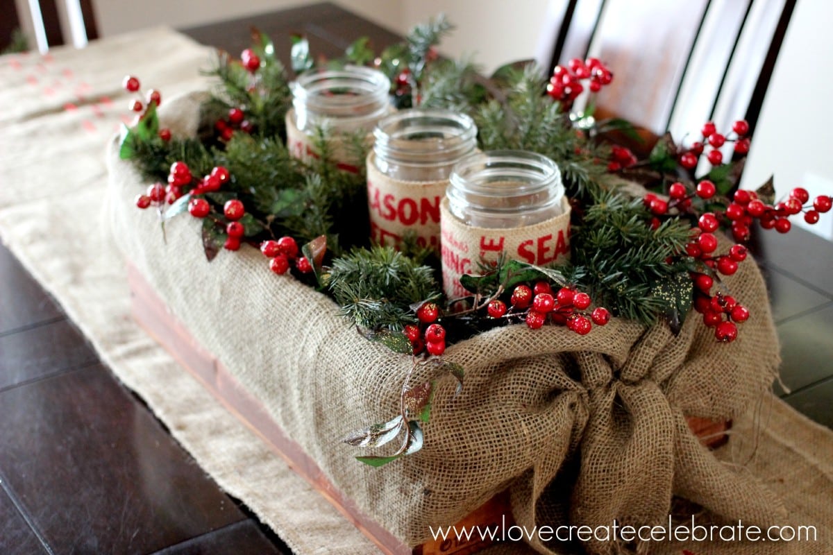 A burlap crate centrepiece with red berries completes the burlap Christmas decorations theme!
