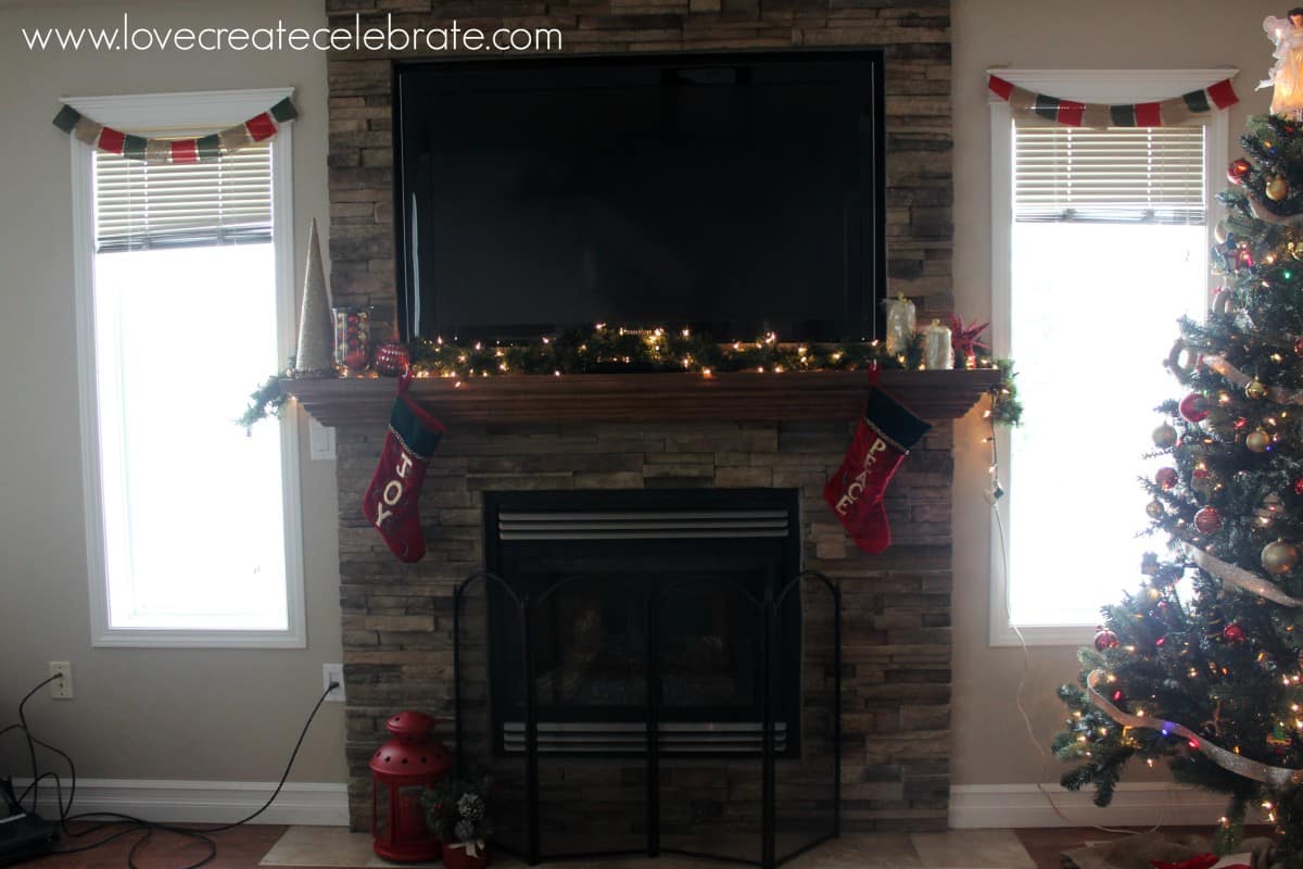 Fire mantlepiece with scattered red & gold decorations