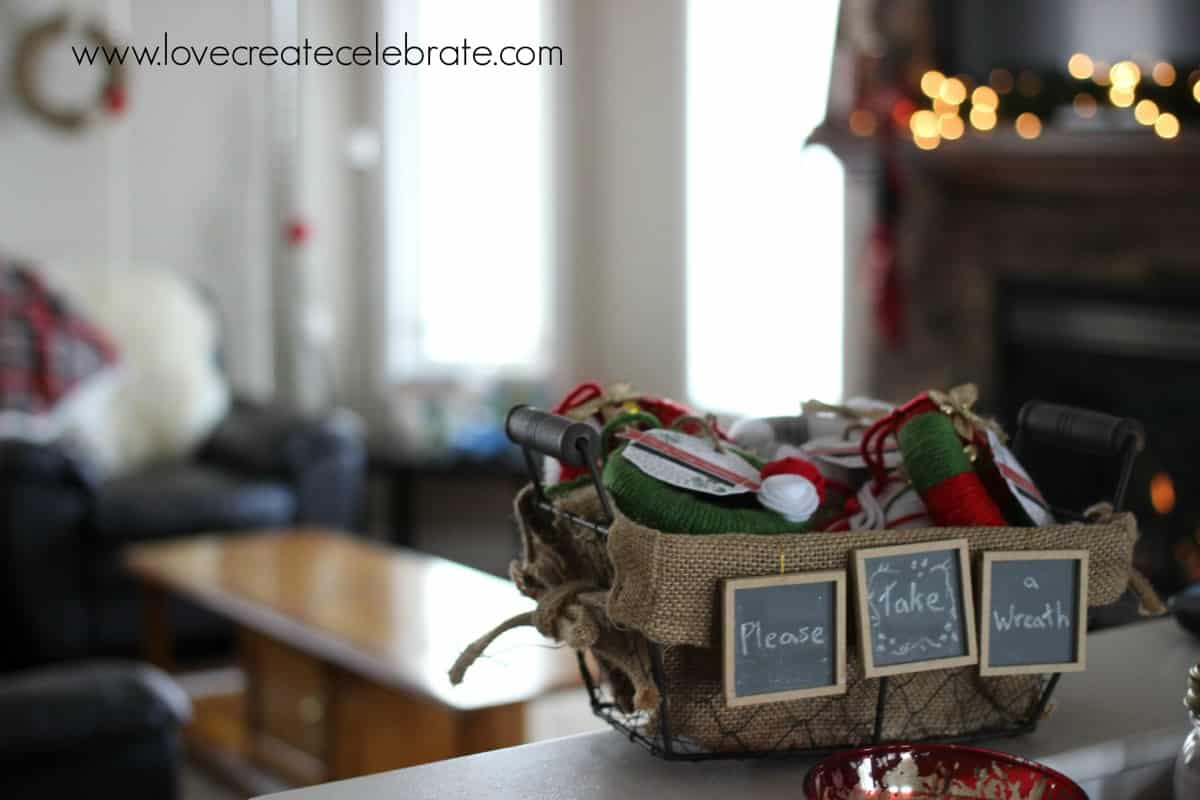 Home-made mini wreaths, inside a burlap Christmas decorations basket.
