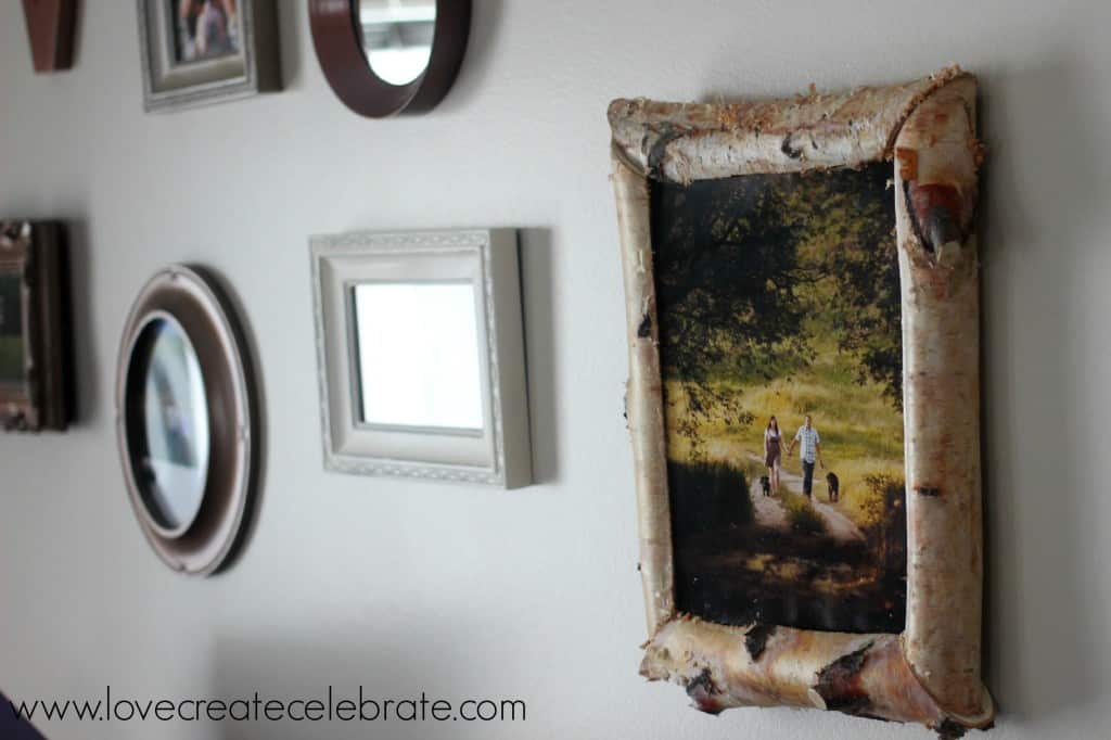 This birch wood picture frame adds a rustic touch to our gallery wall