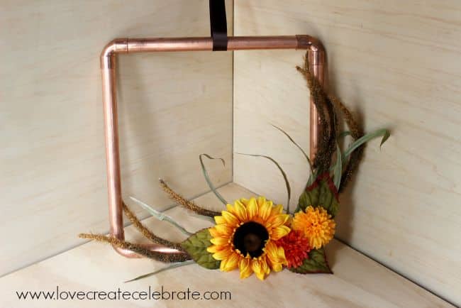 Completed DIY copper pipe fall wreath.