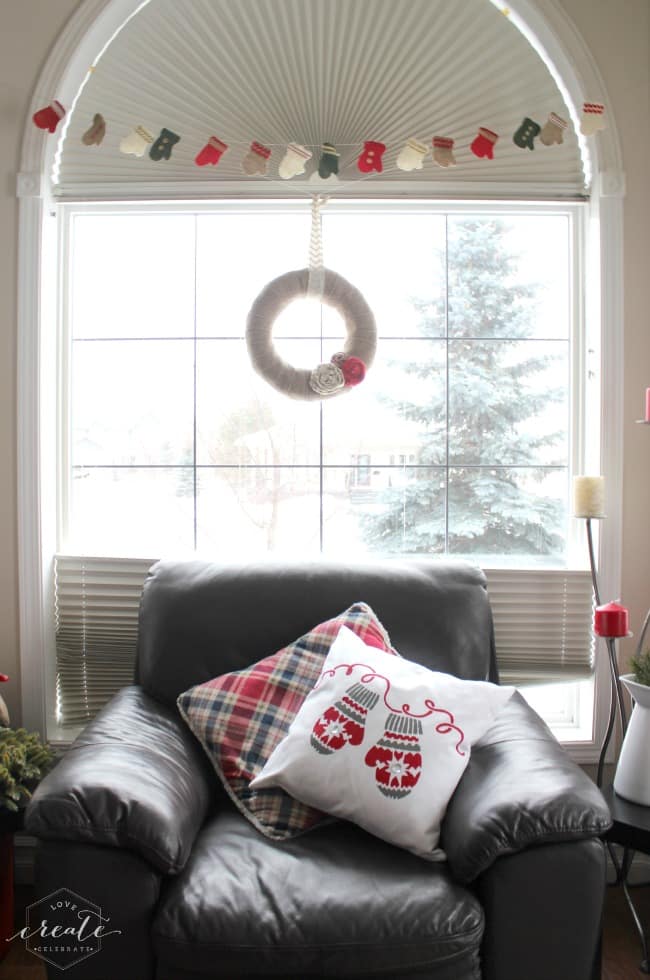 Add the finished stenciled Christmas pillow to your furniture