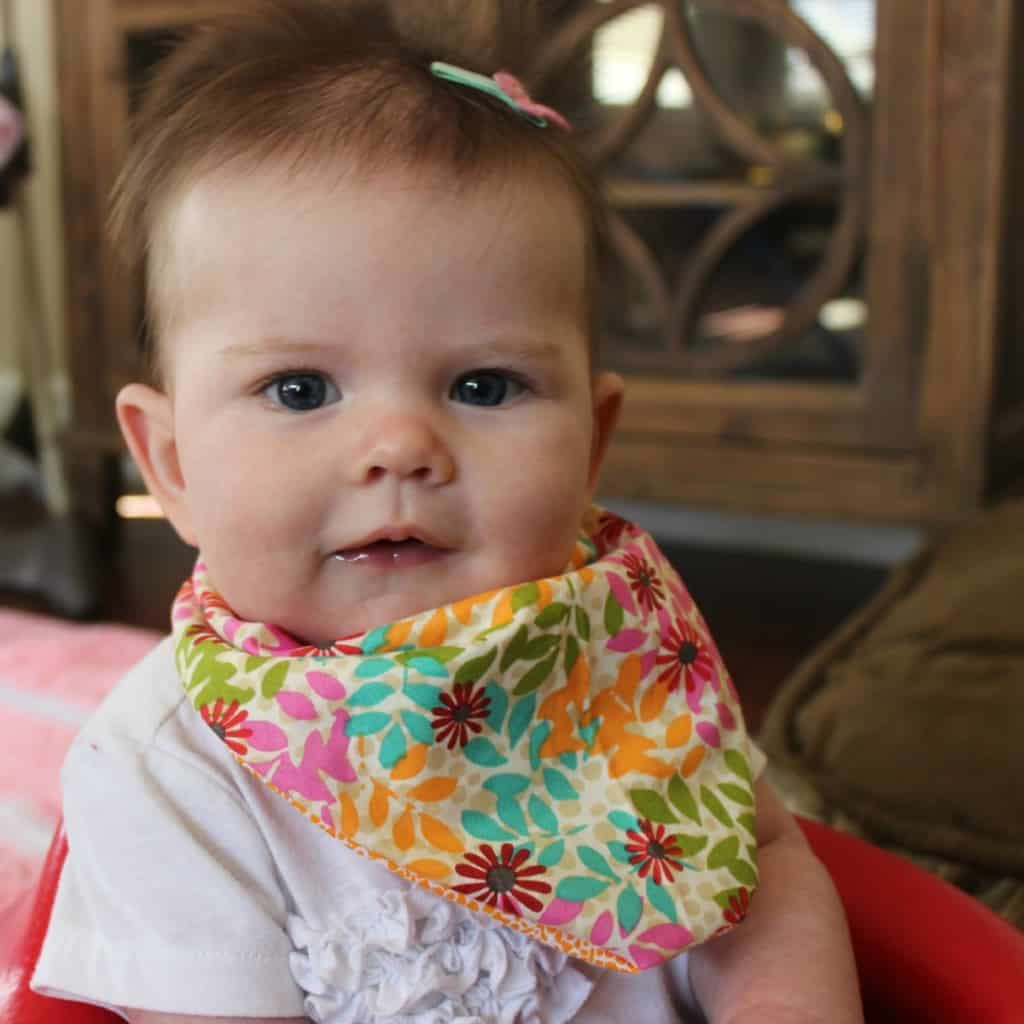 baby bibs are a much needed accessory - make your own with this easy tutorial