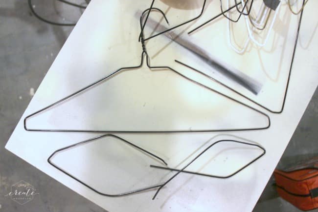 Cut apart the wire hangers and shape them into the sunburst