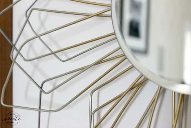 Recycle old wire hangers to create the sunburst effect on this DIY mirror