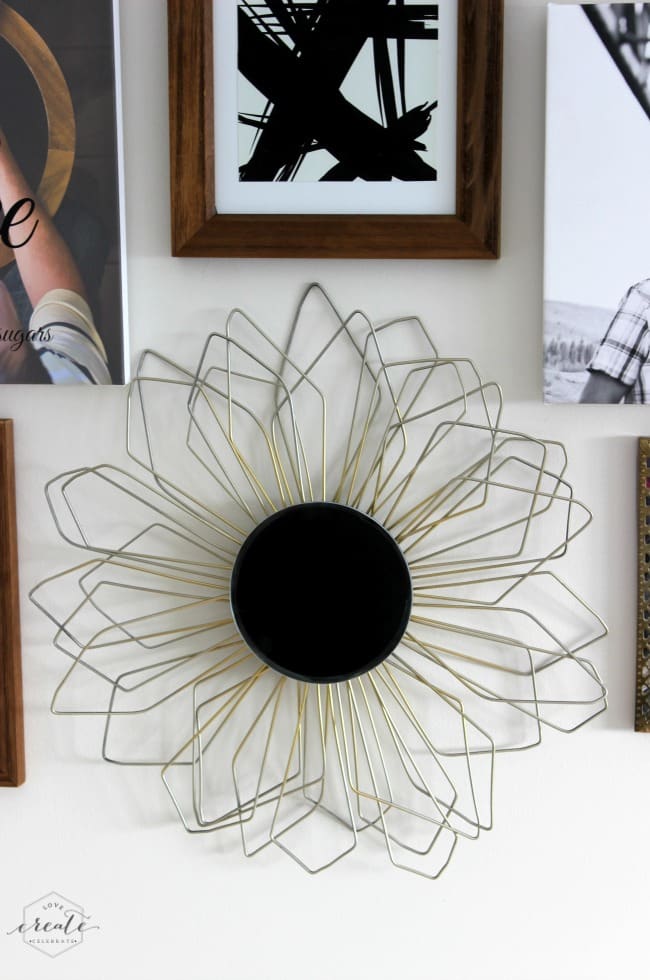 This beautiful DIY sunburst mirror is made with coat hangers and is a modern, stylish decor piece!