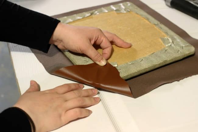 Fold the corner of the faux leather and staple it in place
