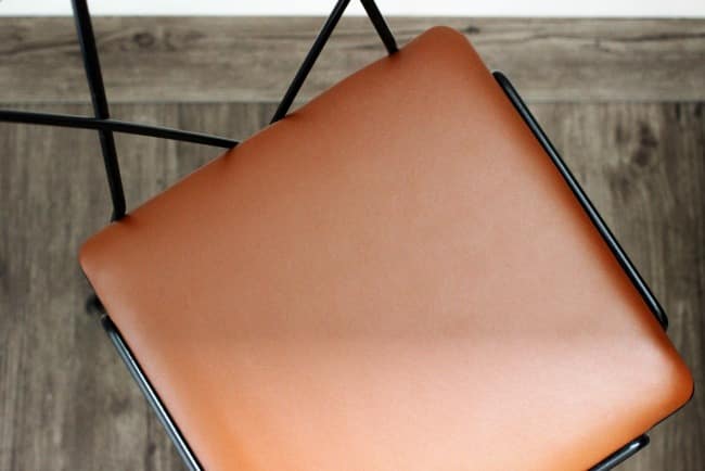 I love the look of this new faux leather upholstered chair cushion! It gives the chair a whole new look
