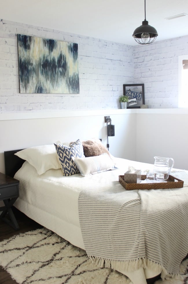 Love the mix of modern and industrial decor in this bedroom design!