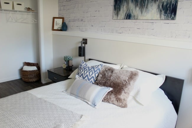 Love the mix of modern and industrial decor in this bedroom design!