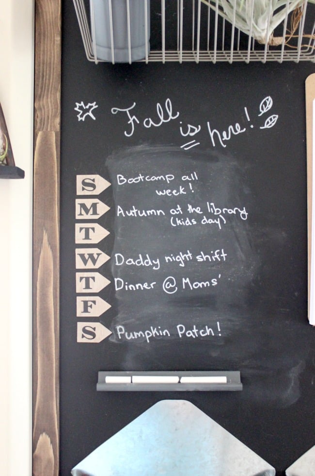A wooden-framed chalkboard is useful and stylish
