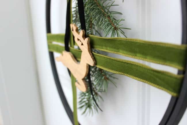 Modern Christmas wreath with green velvet ribbon.