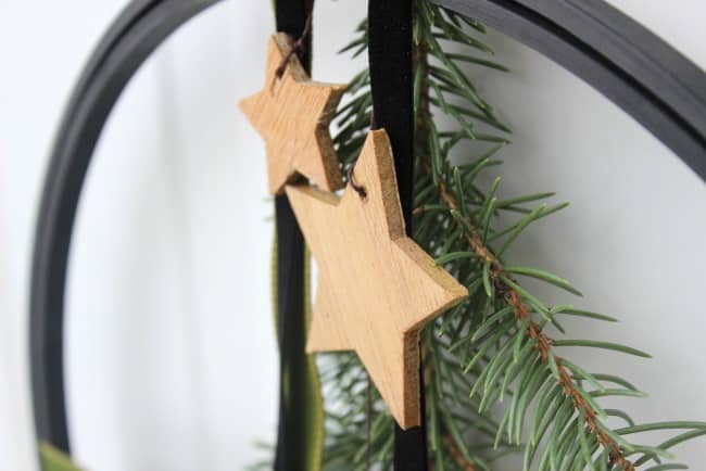 Wooden stars on the modern Christmas wreath.