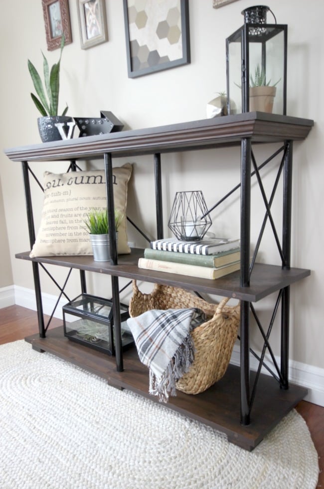 Free build plans for this beautiful rustic industrial furniture piece. This DIY shelf would look perfect in any living room, family room, or in the kitchen as a side board! Love the idea!
