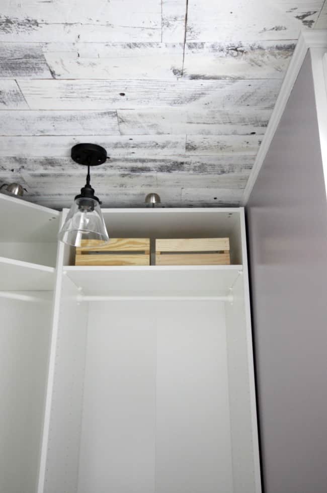 A weathered wood ceiling is a simple way to make a huge statement in this closet.