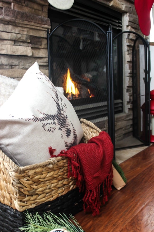 A beautiful rustic fireplace mantel for Christmas! Love the floor to ceiling brick and all of the natural decorations! 