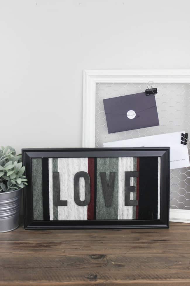 LOVE how she repurposed this old picture frame to make some creative wall art! Great idea for using up your yarn!