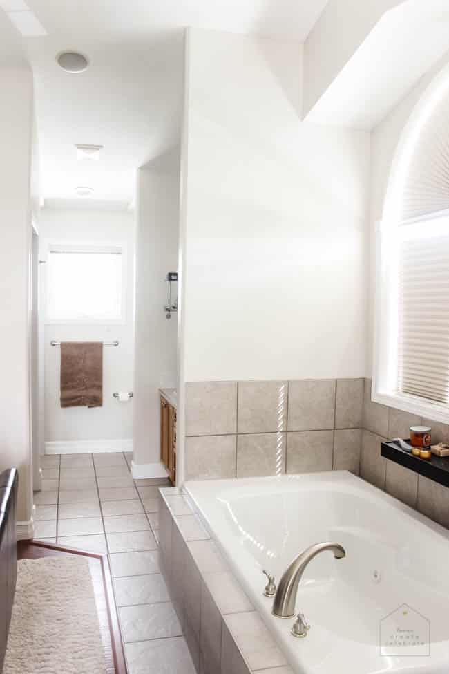 Love this modern bathroom design! Gorgeous faucets, fixtures, and tile choices! Follow along as this outdated bathroom is transformed into a beautiful modern oasis!