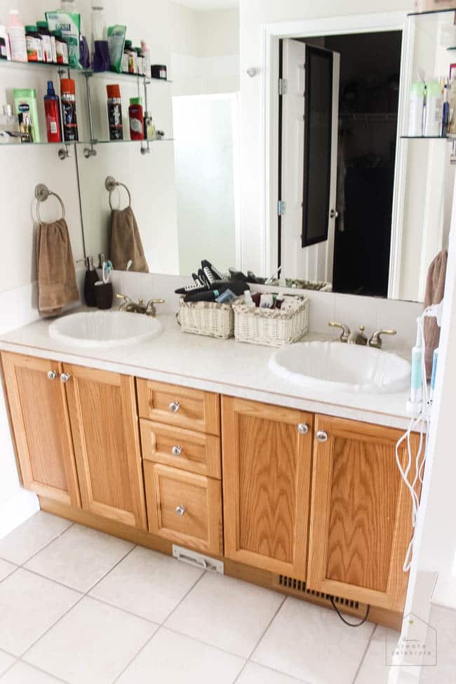 Love this modern bathroom design! Gorgeous faucets, fixtures, and tile choices! Follow along as this outdated bathroom is transformed into a beautiful modern oasis!