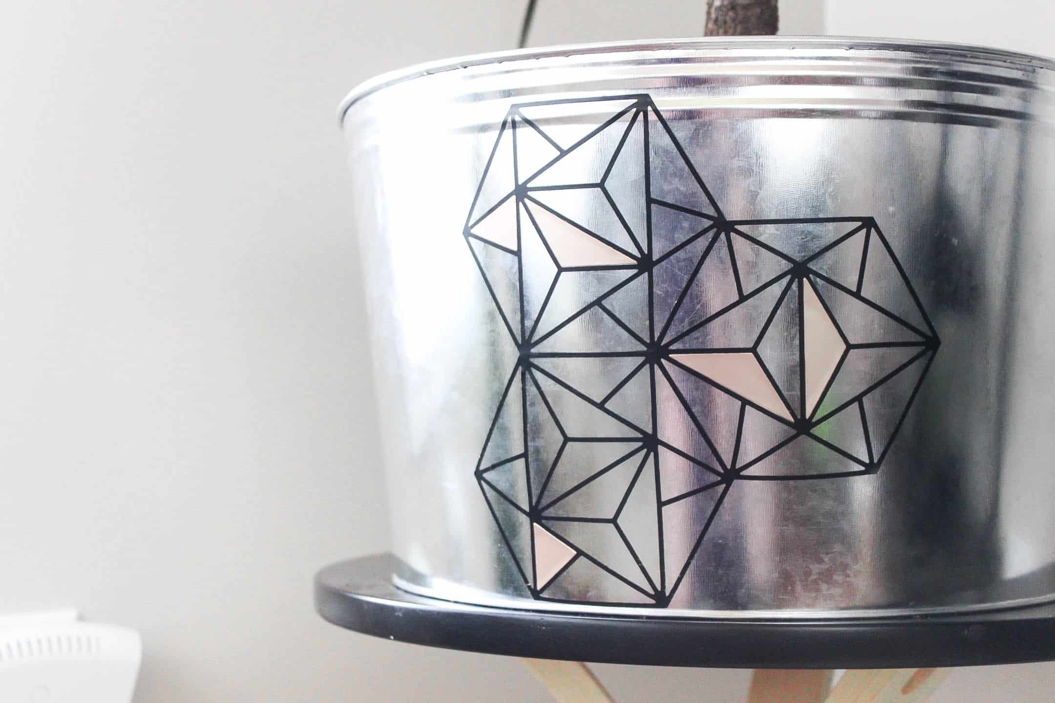 Make this modern geometric planter for any corner in your home. Love the indurstrial chic flair to this home decor project idea!