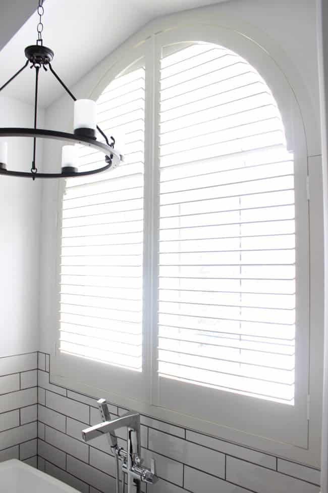 These shutters let tons of natural light in the newly remodeled bathroom.