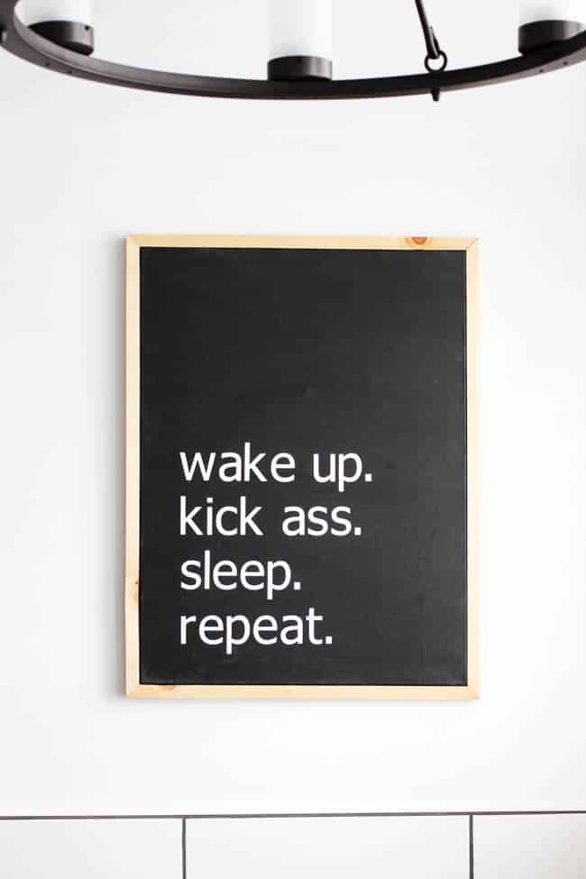 Make your own custom typography canvas with iron-on vinyl and paint. A sleek modern canvas for your bedroom or bathroom. Love the "wake up. kick ass. sleep. repeat."