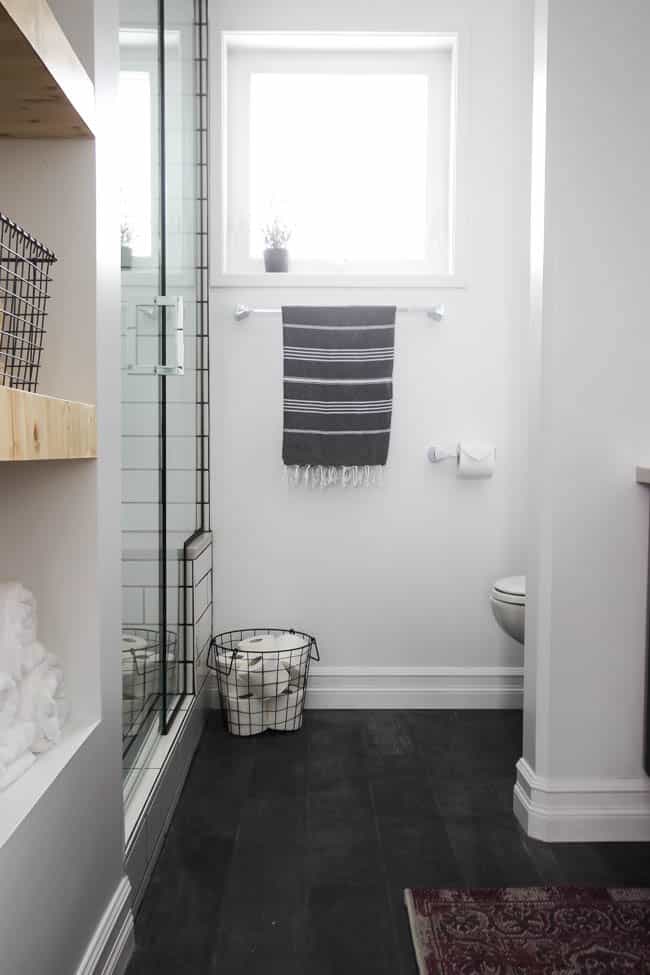 The contrast of light and dark blend beautifully in this remodeled modern bathroom.