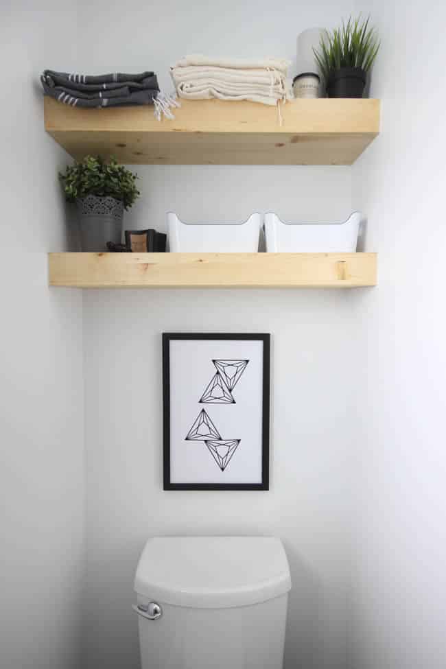 Floating, wooden shelves add storage and placement for decorations.