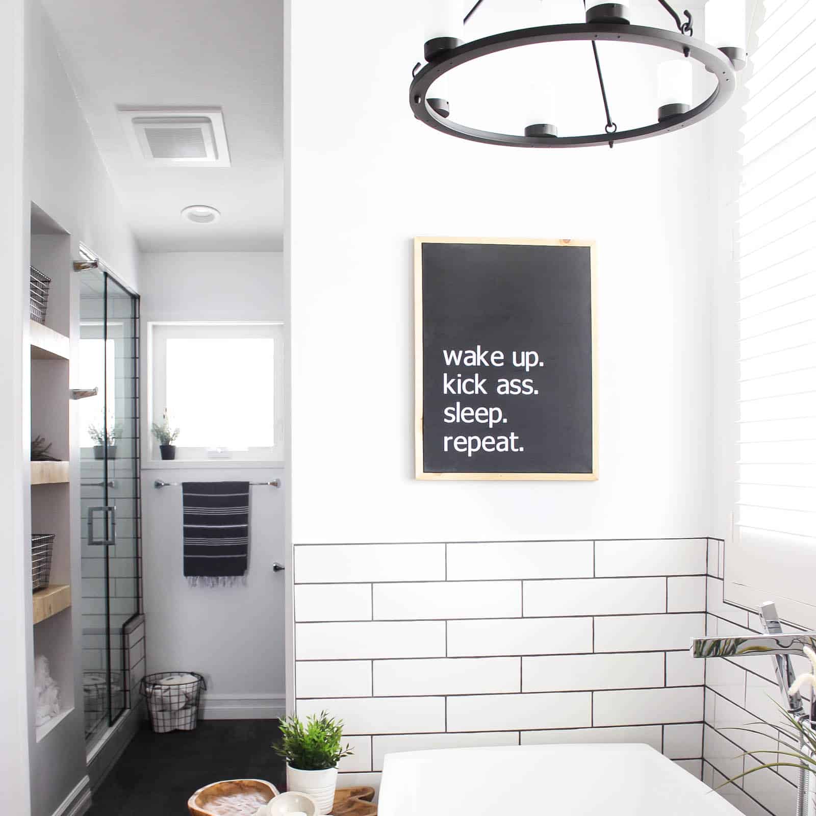 Make your own custom typography canvas with iron-on vinyl and paint. A sleek modern canvas for your bedroom or bathroom. Love the 