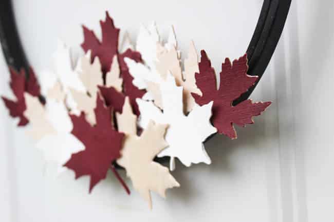 A beautiful modern hoop wreath for Canada Day! Using a simple embroidery hoop and balsa wood maple leaves, you can celebrate the birthday of Canada in style! Love the red, white, and black! 