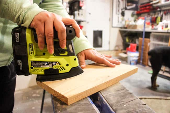 Image of a wooden board being sanded