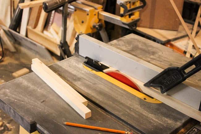 Using a table saw to cut all the wooden pieces 