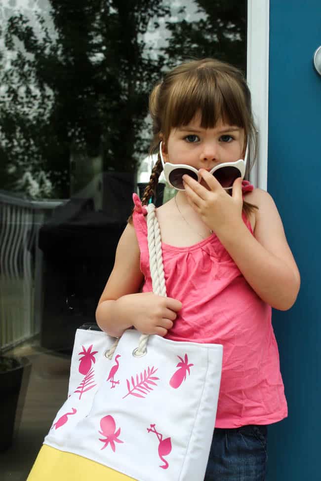 Fun personalized summer tote bag! Make it for yourself or your kids and head to the beach this summer in style. Easy to make with iron-on vinyl!