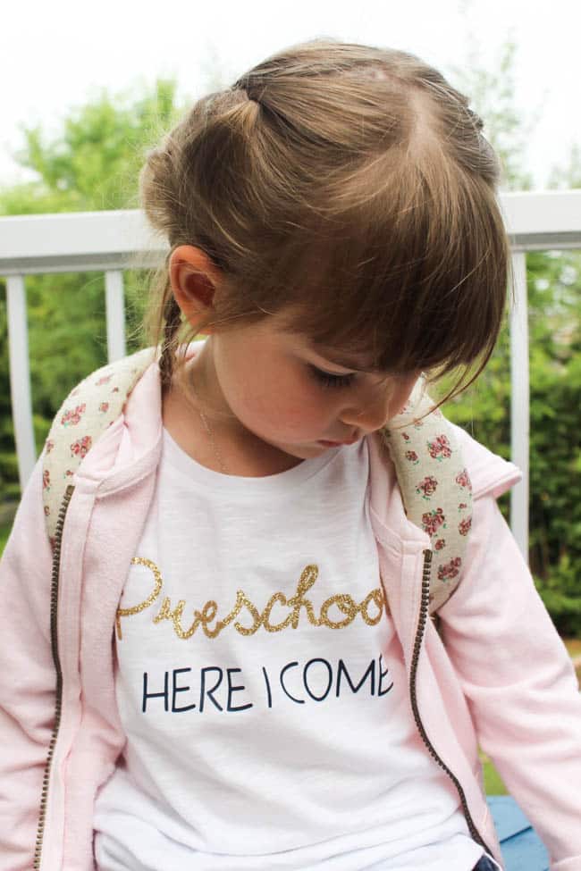 Little girl in t-shirt with text "Preschool here I come"