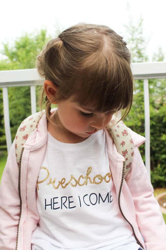 Little girl wearing "Preschool here I come" t-shirt. 