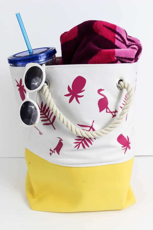 Fun personalized summer tote bag! Make it for yourself or your kids and head to the beach this summer in style. Easy to make with iron-on vinyl!