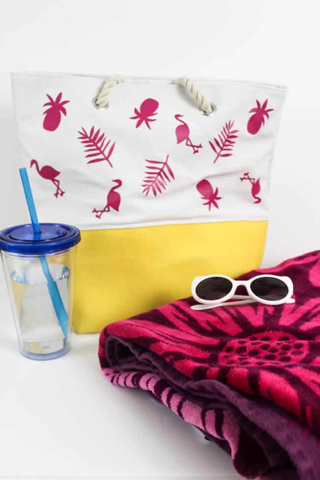 Fun personalized summer tote bag! Make it for yourself or your kids and head to the beach this summer in style. Easy to make with iron-on vinyl!