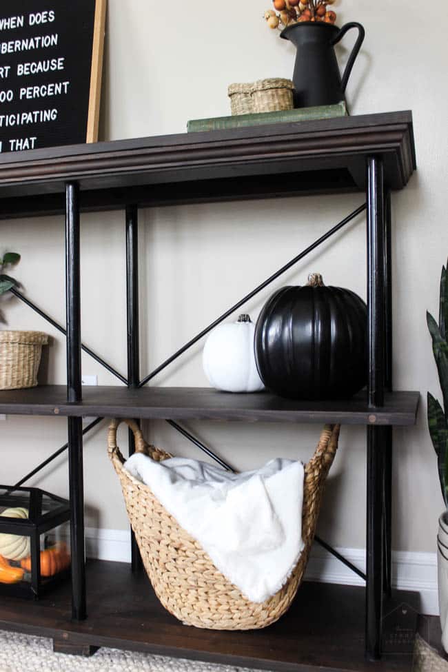 A sideboard with fall-themed decor adds a nice focus 