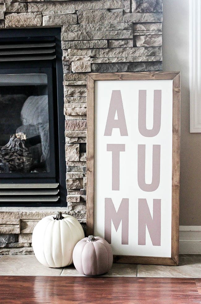 Love these Fall and Christmas custom wood signs! Beautiful decor for the fall and holiday seasons. Learn how you can make your own custom wood sign for the home with this simple DIY tutorial. The perfect sign and shape for your fireplace and mantle decor!