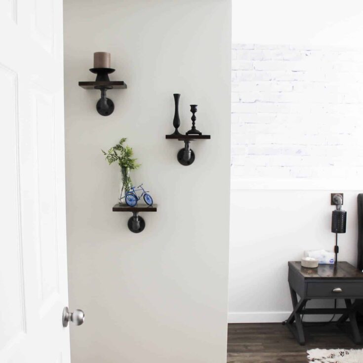 These mini industrial shelves are easy to build and perfect for any empty wall! These DIY pipe shelves are modern and beautiful!