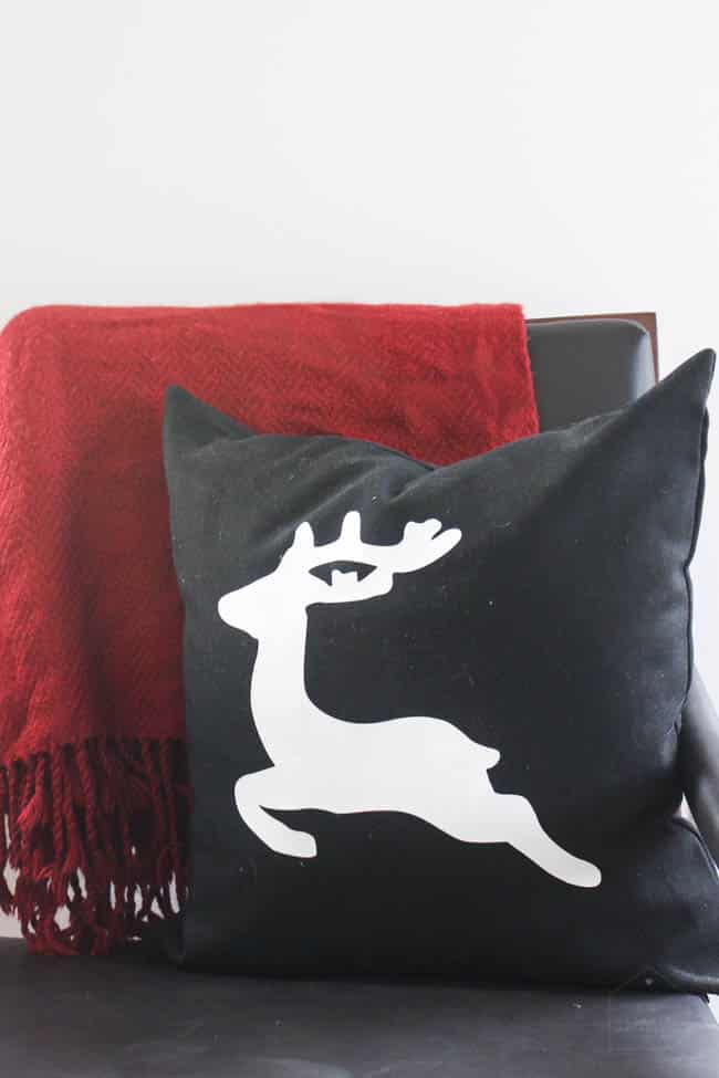 The easiest ever Christmas Pillows to make! These festive DIY holiday pillows will have everyone wondering where you bought them! Make them in less than 30 minutes and enjoy these modern pillows for the entire season. Download the "joy" and deer images free!