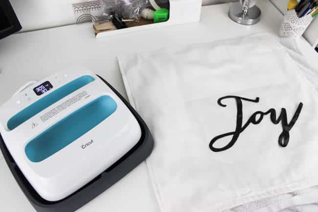 The cricut easypress to apply the heat transfer vinyl