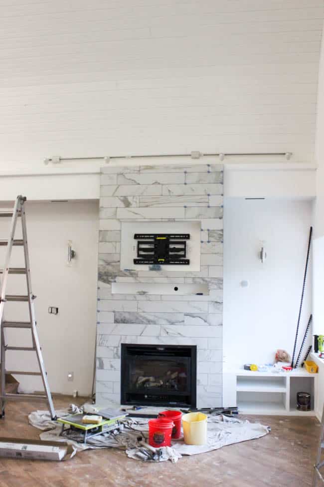 A One Room Challenge Update showing off our newly tiled fireplace and furniture arrivals! Plus an ATR Tile Leveling System Review.