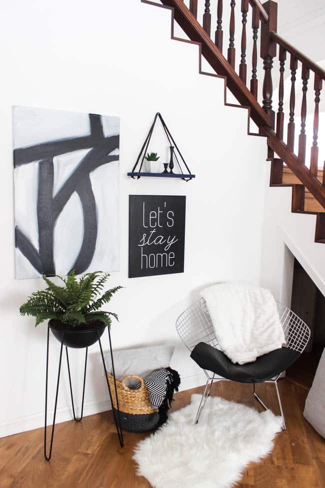 This gorgeous Modern Living Room reveal is finally here! This space came a long way from an outdated, empty space in this beautiful barn home. Love all of the contemporary DIY and decor ideas in this beautiful living space! The tiled fireplace and blue couch are stunning!