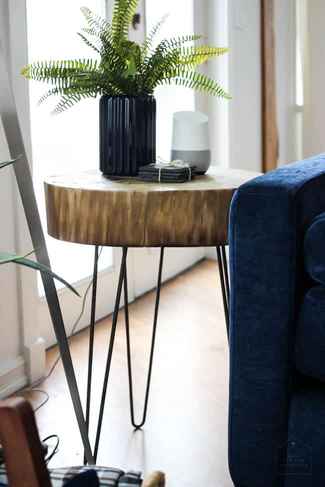 This gorgeous Modern Living Room reveal is finally here! This space came a long way from an outdated, empty space in this beautiful barn home. Love all of the contemporary DIY and decor ideas in this beautiful living space! The tiled fireplace and blue couch are stunning!