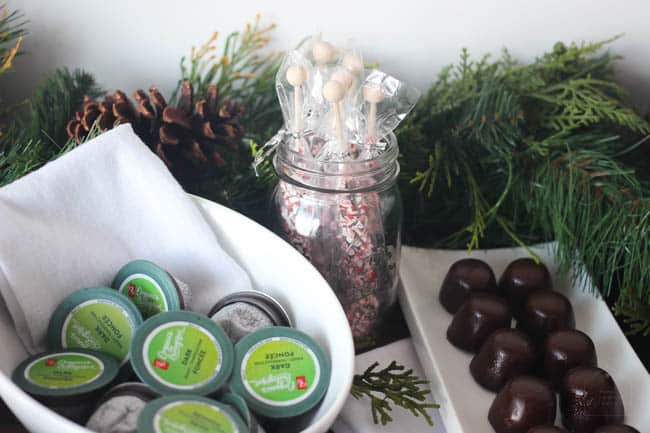 Coffee pods and desserts on a table.