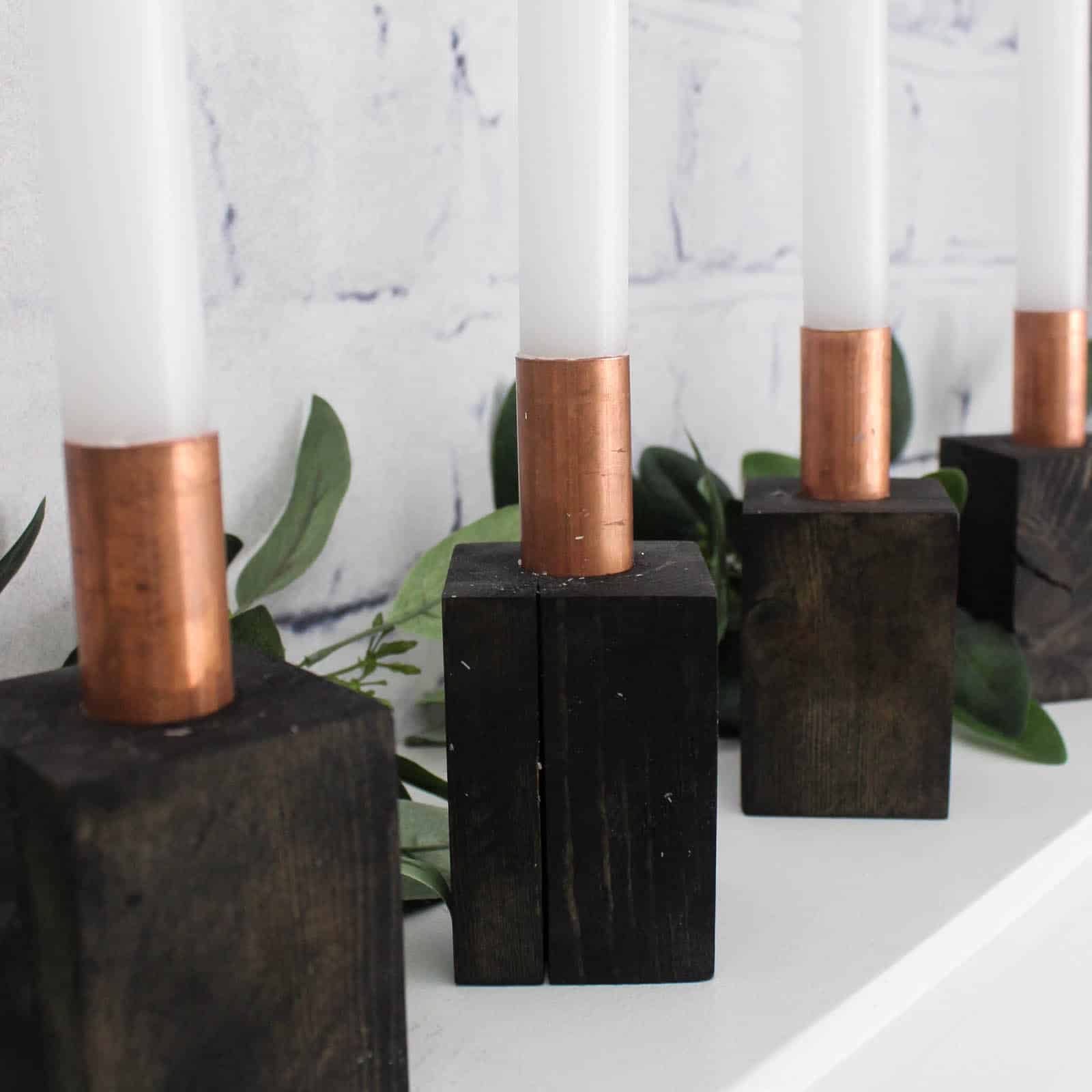 I love these beautiful modern Advent Candlesticks. This DIY is the perfect addition to your Christmas decor and the perfect way to celebrate the meaning behind Christmas. The addition to celebrate advent this holiday season!