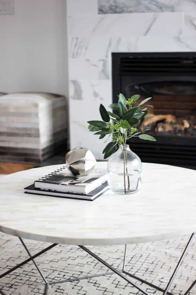 This gorgeous Modern Living Room reveal is finally here! This space came a long way from an outdated, empty space in this beautiful barn home. Love all of the contemporary DIY and decor ideas in this beautiful living space! The tiled fireplace and blue couch are stunning!