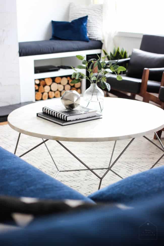 This gorgeous Modern Living Room reveal is finally here! This space came a long way from an outdated, empty space in this beautiful barn home. Love all of the contemporary DIY and decor ideas in this beautiful living space! The tiled fireplace and blue couch are stunning!